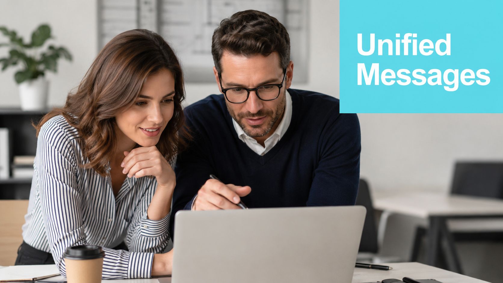 A professional man and woman collaborating on a business project together in a modern office environment.
